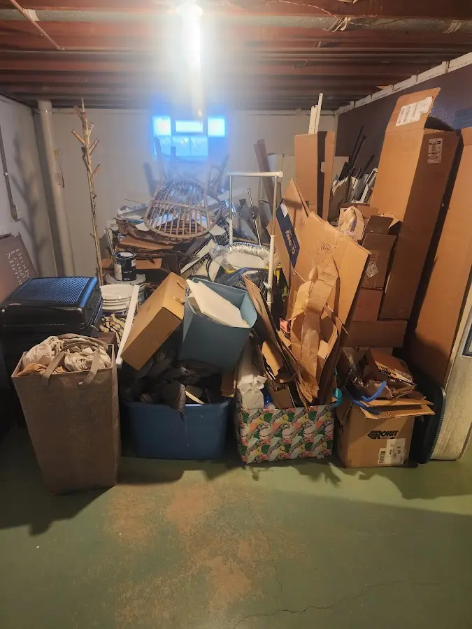 Roll-off dumpster container at job site for 4 Yard Dumpster Rental in Pella